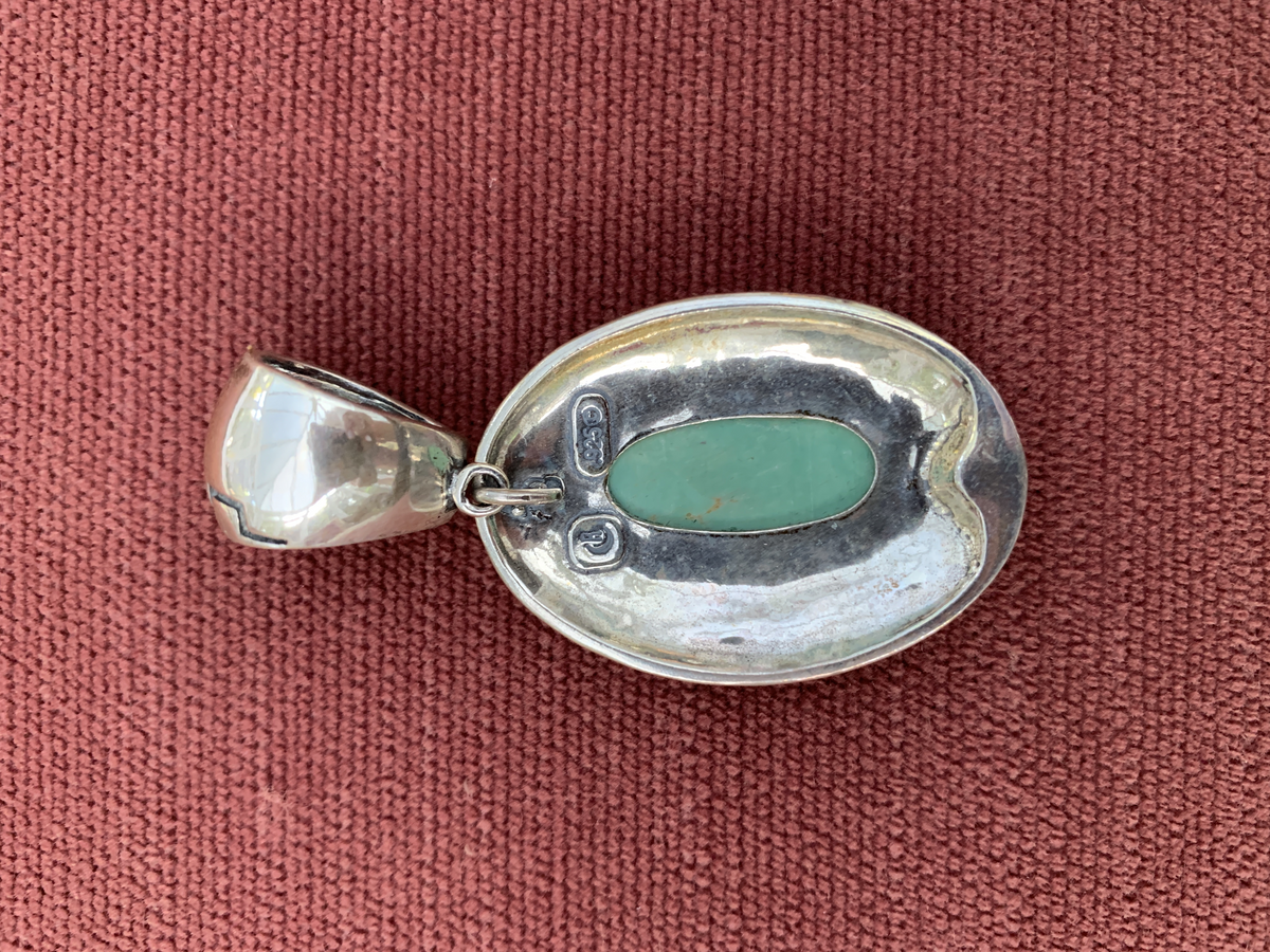 Native American Style Sterling Silver Turquoise Oval Pendantwith Rope Design